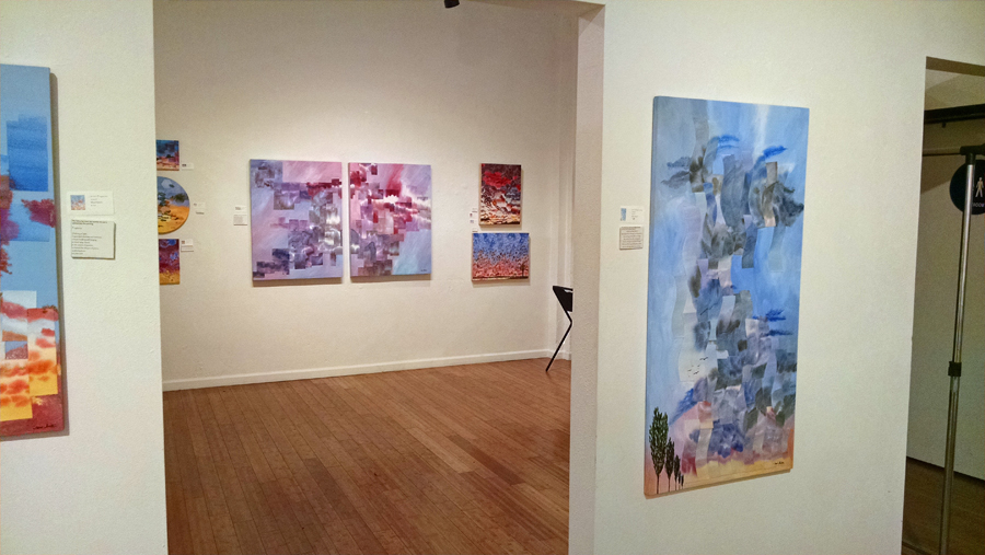 Mixed media paintings in a gallery