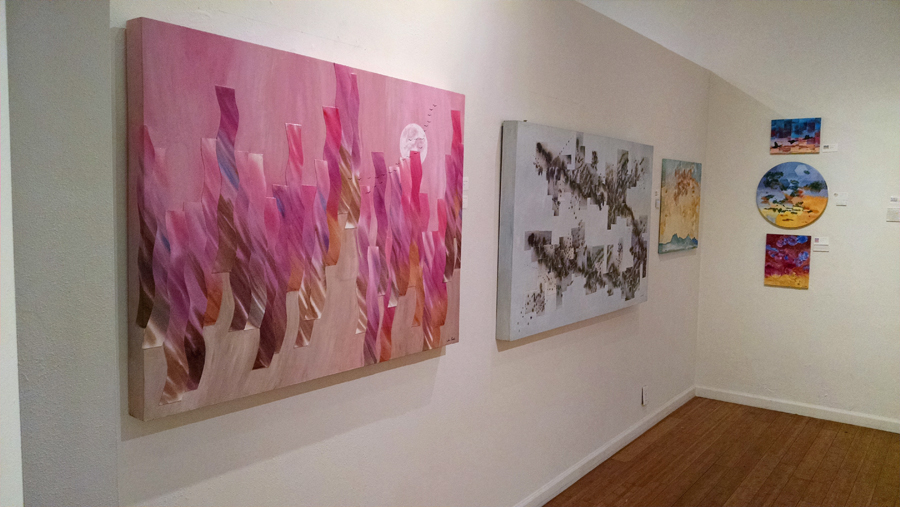 Mixed media paintings in a gallery